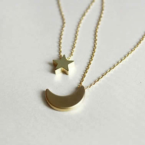 Golden Moon and Star Charms on a Layered Chain Necklace Vista Shops